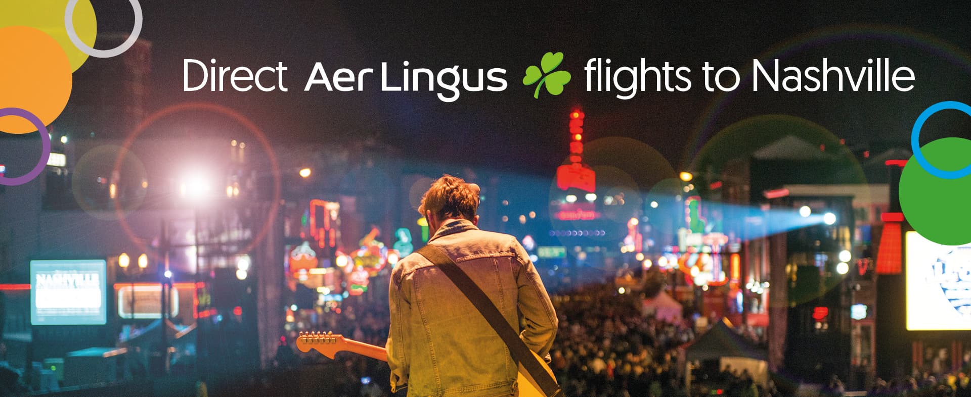 Musician playing guitar on stage with a lively neon-lit street in the background, promoting Aer Lingus direct flights to Nashville.