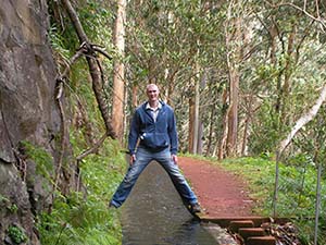 Manfully straddling a levada on holiday in Madeira