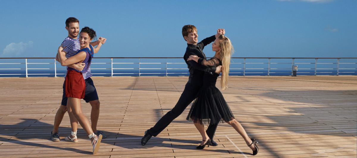 Dance lesson on upper deck | The Cunard Experience