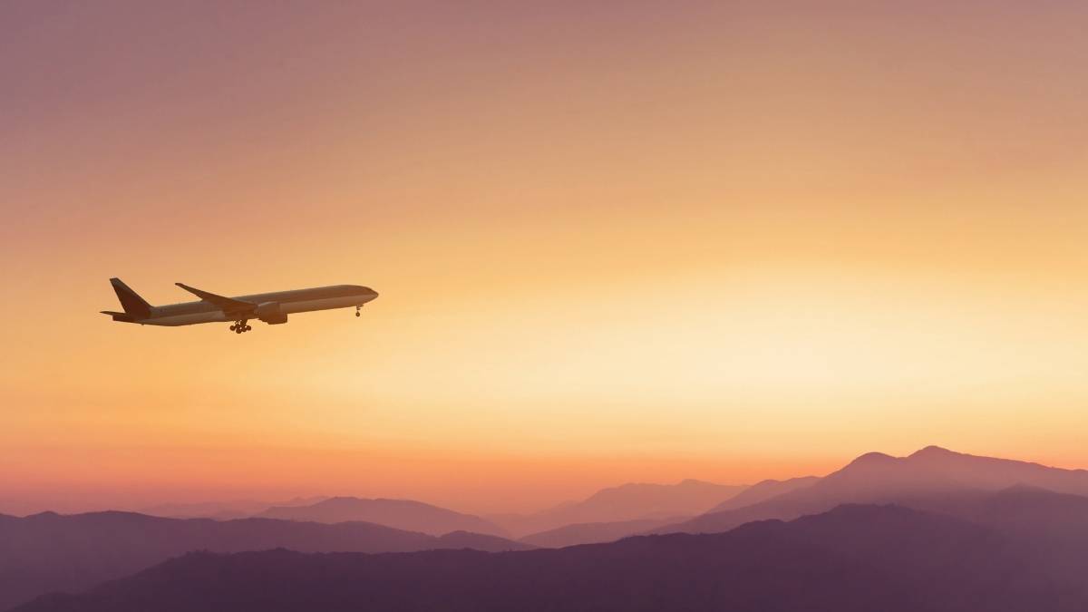 Airplane flying over mountains