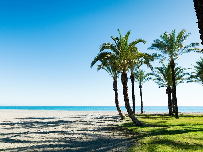  A beach in Benalmadena with blue skies