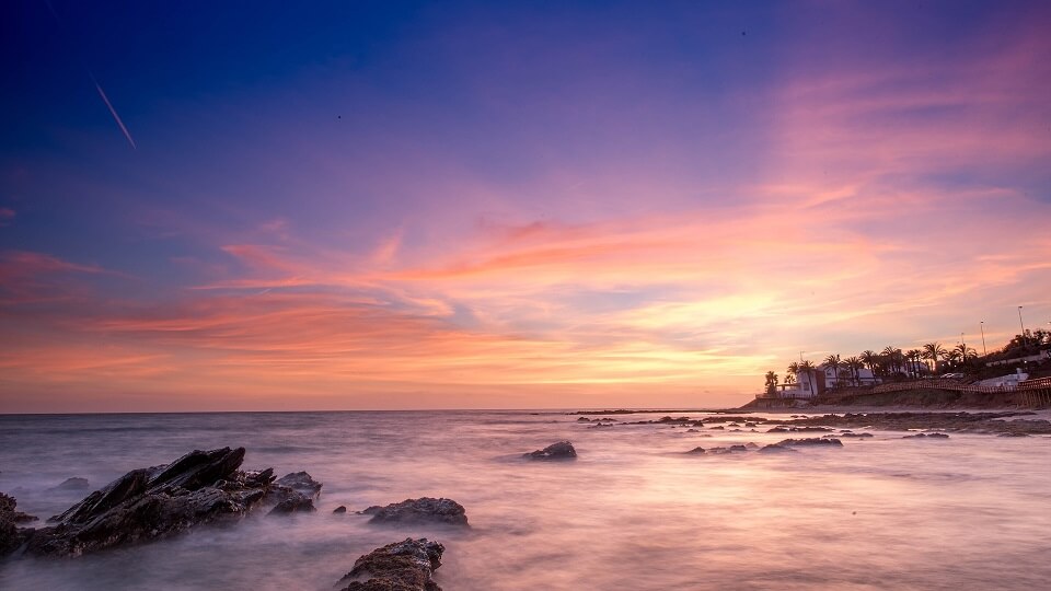 sunset at a beach in Malaga in the costa del sol