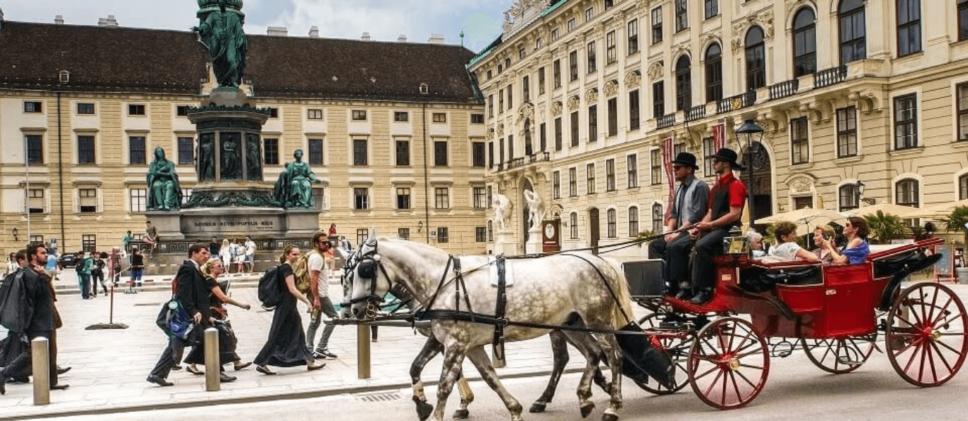 Horse and carriage on the grounds of the Hofburg Palace in Vienna, Austria.