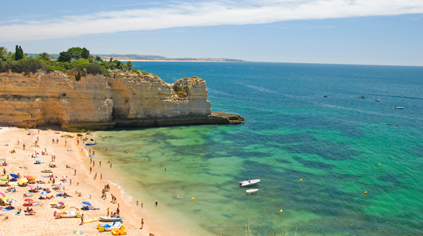 Family-friendly beach in the Algarve with golden sand, turquoise water and scenic cliffs