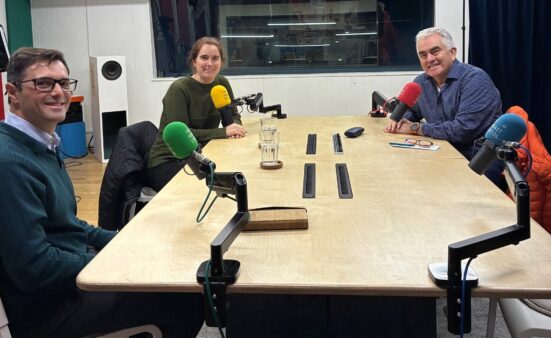 Recording a Click&Go Holidays podcast in a studio, seated around a table with microphones, discussing travel to Portugal