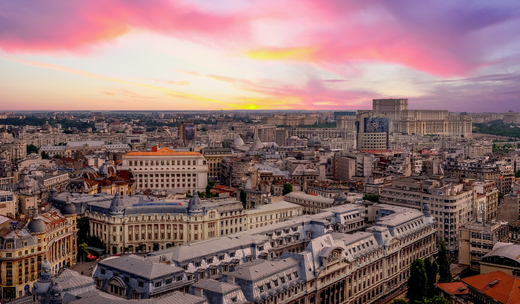 View of the Bucharest skyline featuring stunning historical buildings as the sunsets.