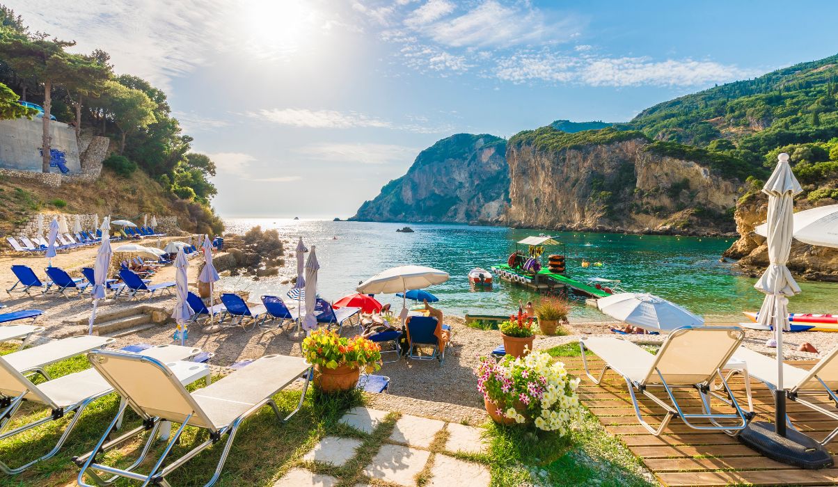 Aerial perspective of the beautiful Corfu island showing lush landscapes and crystal-clear waters.